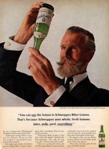 Advertising image of Commander Whitehead examining a bottle of Schweppes